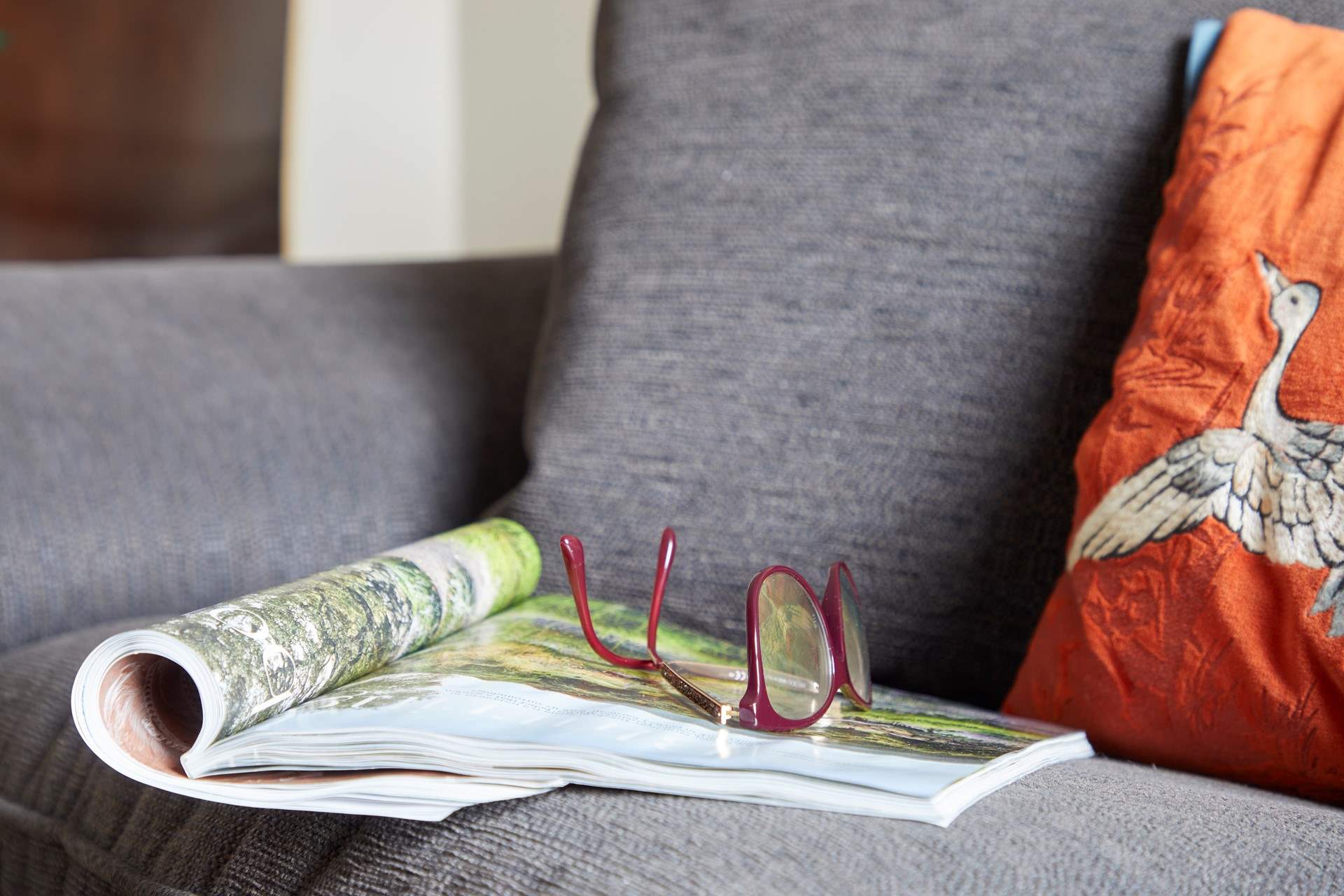 Relax on the comfortable sofa with an interesting magazine.