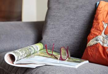Sit down on the comfortable sofa with an interesting magazine.