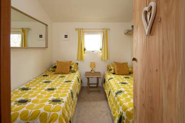 Bedroom 2 is home to these attractive twin beds.