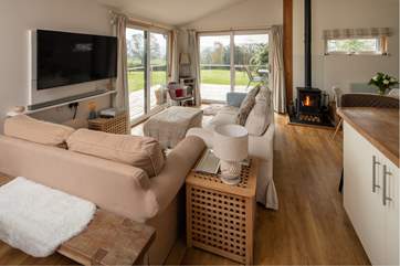The sitting-area enjoys a cosy configuration, whilst enjoying the panoramic countryside views.