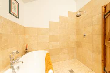 As well as the roll-top bath there is a fabulous wet-room style rainfall shower.