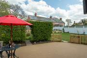 You have your own private patio area at Swallows' Rest that ensures your privacy. The owners live in the house pictured.