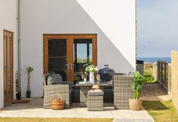 The patio area is perfect for a barbecue or a relaxed glass of wine in the sunshine.