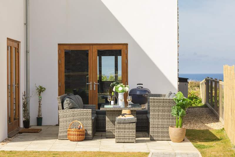 The patio area is perfect for a barbecue or a relaxed glass of wine in the sunshine.
