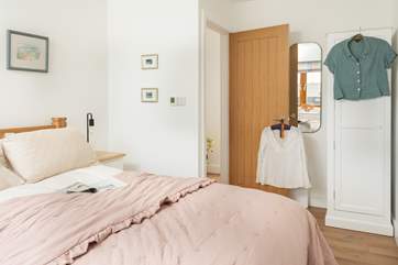 Calm and hushed tones can be found in this bedroom.