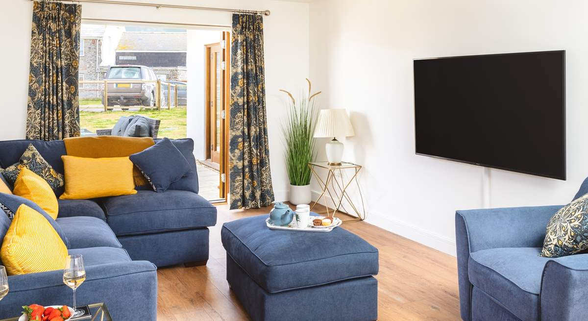 The double doors from the sitting-room open directly to the patio. 