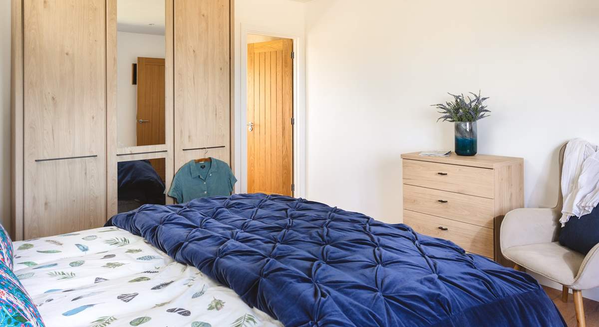 The main bedroom has a king-size bed and an en suite shower-room. 