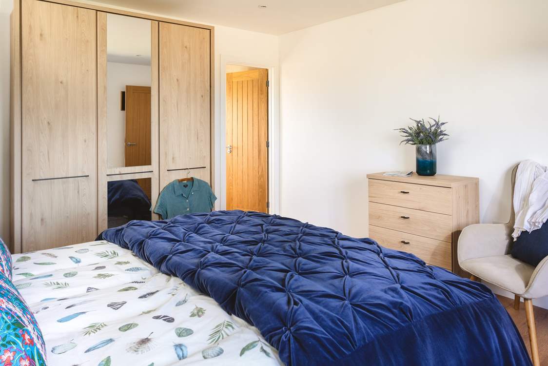 The main bedroom has a king-size bed and an en suite shower-room.
