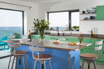 The super light and airy open plan kitchen and dining area is like no other. With a central breakfast-bar to chat around.