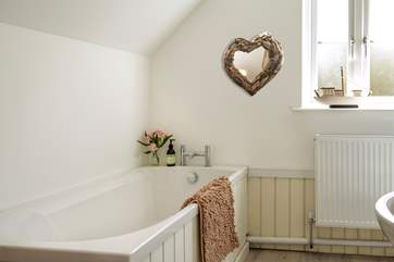Enjoy a leisurely soak in the family bathroom.