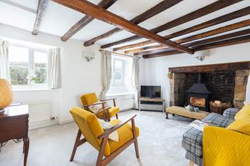The sitting-room has been styled and furnished to complement the original features in this room.
