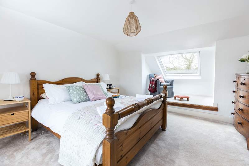 The beautiful main bedroom offers a spacious room that floods with light.