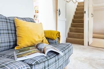 Behind the door you will find the stairs up to the first floor. The stairs are steep but there is a handrail to help you up and down with ease and care.