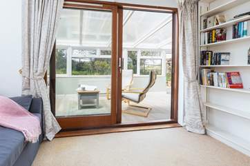 From the sitting-room you enter a lovely little reading room which leads through to the conservatory.