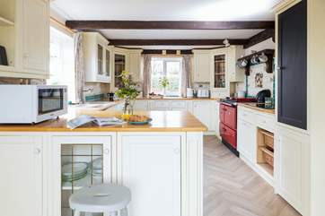 The kitchen is positioned next to the conservatory.