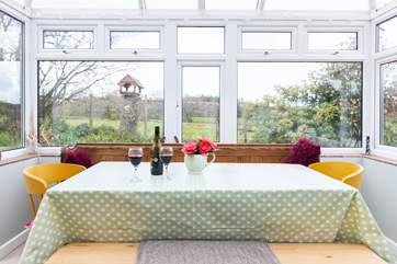 The dining-table has views of the surrounding fields.