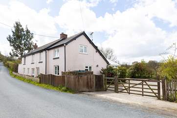 Set back from the road you will find Woodbrook.