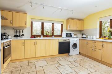 With views down to the lake across the garden the kitchen really does flood with light.