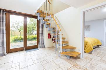 The open-tread stairs to the sitting-room, twin bedroom and shower-room.