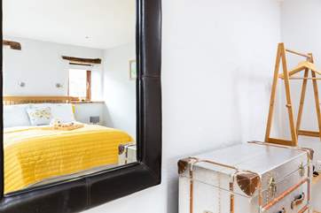Both bedrooms are light and airy adding to the relaxed feel.