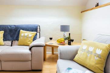 The comfy upstairs sitting-room benefits from a lovely log-burner.