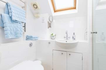 The shower-room sits on the open plan landing between the sitting-room and twin bedroom.