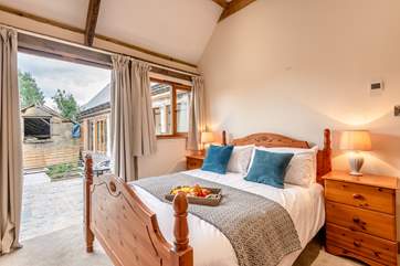 Bedroom 2 has patio doors to the terraced area.
