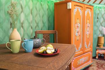 The eccentric furnishings add to the unique charm of your glamping getaway.