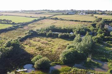 Aerial view of the owner's lake where you are welcome to enjoy a picnic or spot of yoga on the decking. Or, if you are feeling brave, hop in for a wild swim.