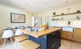 The dining area and kitchen, perfect for sociable family time. - Thumbnail Image