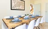 The lovely dining-table, the perfect place to discuss the day ahead. - Thumbnail Image