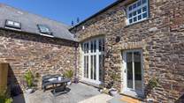 Outside the patio doors you'll find the perfect quiet spot. The barn is terraced but still offers total privacy at the front and back.