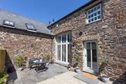 Outside the patio doors you'll find the perfect quiet spot. The barn is terraced but still offers total privacy at the front and back.
