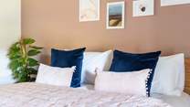 Sumptuous bedding awaits in the main bedroom.