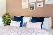 Sumptuous bedding awaits in the main bedroom.