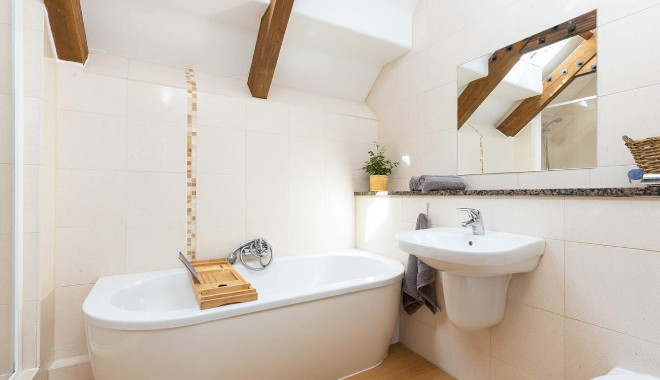 The family bathroom with exposed beams is lovely.