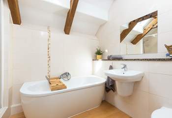 The family bathroom with exposed beams is lovely.