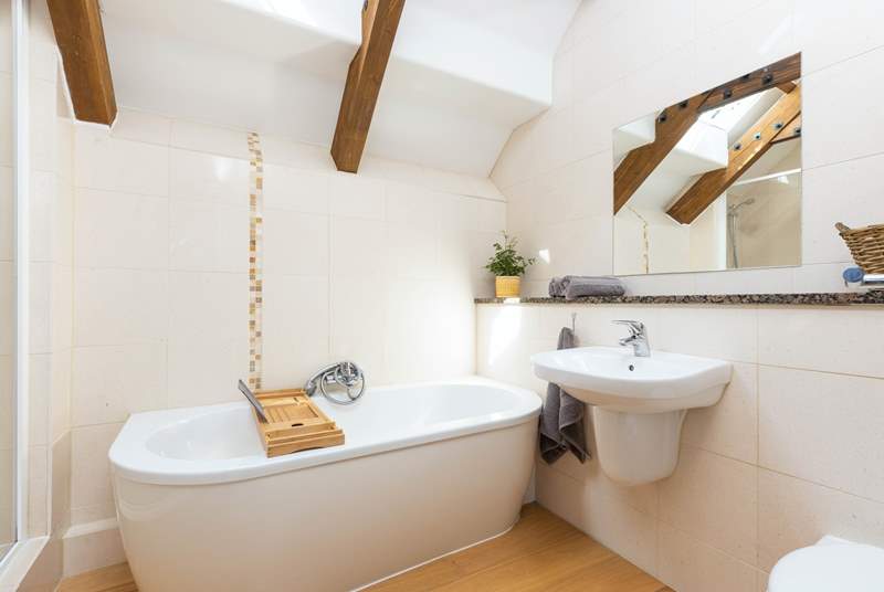 The family bathroom with exposed beams is lovely.