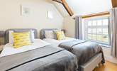 Bedroom 4 with twin beds has a lovely view of the garden. - Thumbnail Image