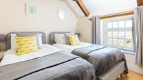 Bedroom 4 with twin beds has a lovely view of the garden.