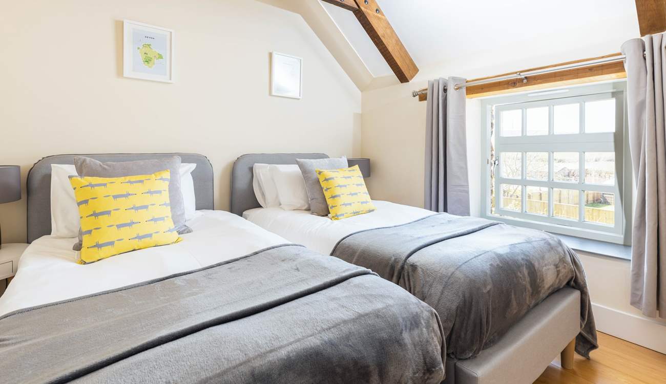 Bedroom 4 with twin beds has a lovely view of the garden.