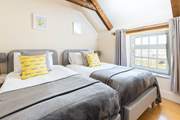 Bedroom 4 with twin beds has a lovely view of the garden.