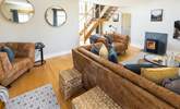 The sitting-room with open-tread staircase leading to the first floor. - Thumbnail Image