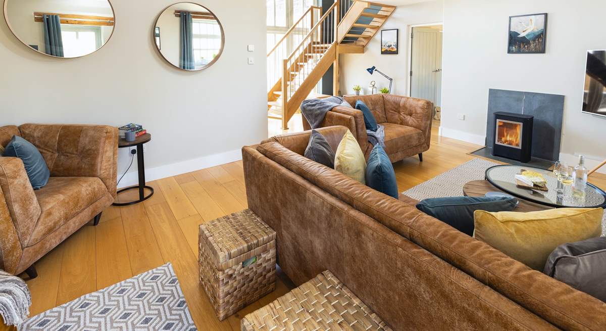 The sitting-room with open-tread staircase leading to the first floor.