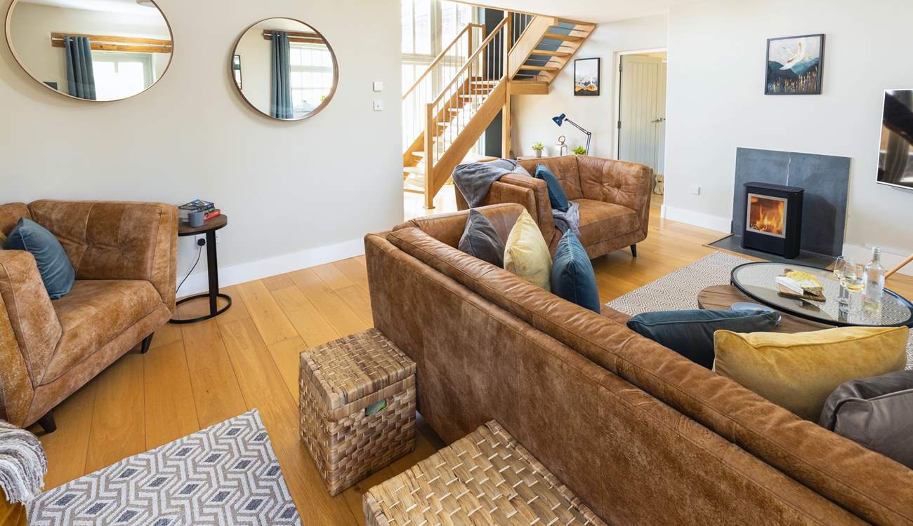 The sitting-room with open-tread staircase leading to the first floor.