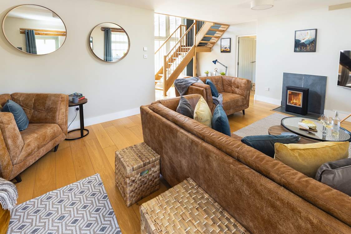 The sitting-room with open-tread staircase leading to the first floor.