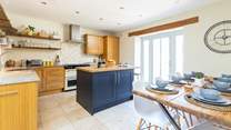 The light and airy kitchen/diner with patio doors to the garden.