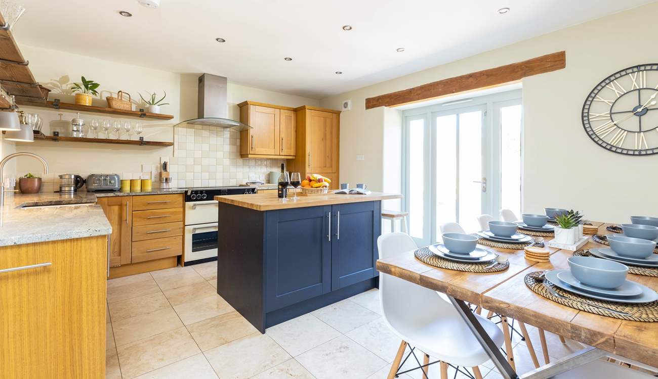 The light and airy kitchen/diner with patio doors to the garden.