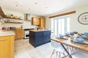 The light and airy kitchen/diner with patio doors to the garden.