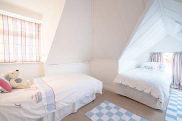 One of the twin rooms on the second floor, with restricted head height in some areas.